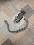 80-86 Ford F150 4.9 Inline Single Barrel Carburetor Spacer And Egr Tube Used. Price: $150.00.